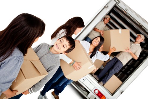 Packed moving boxes and furniture ready for transport