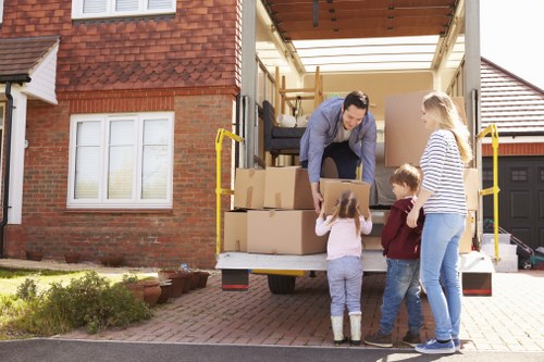 Removalists loading furniture carefully at a local Bexley home