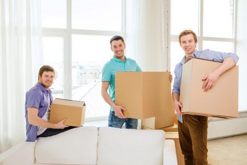 Packed moving boxes and furniture ready for transport in Bexley