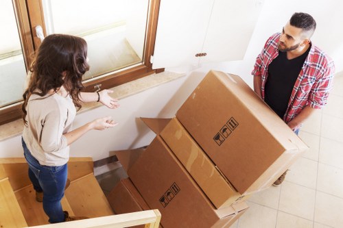 Trained removal staff handling boxes carefully