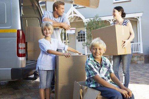 Man and van service loading goods into a vehicle