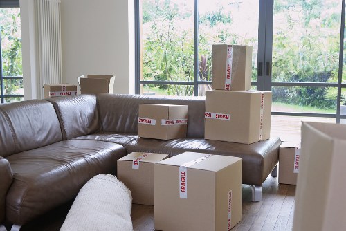 Professional movers carrying furniture during a Bexley home relocation